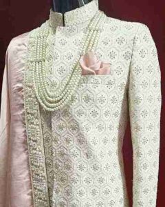 Elegant royal sherwani in maroon and gold color, designed for Indian weddings and special occasions, available at www.vsasingh.com”